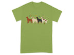 Four dogs in a row with stars and moons on a green t-shirt.