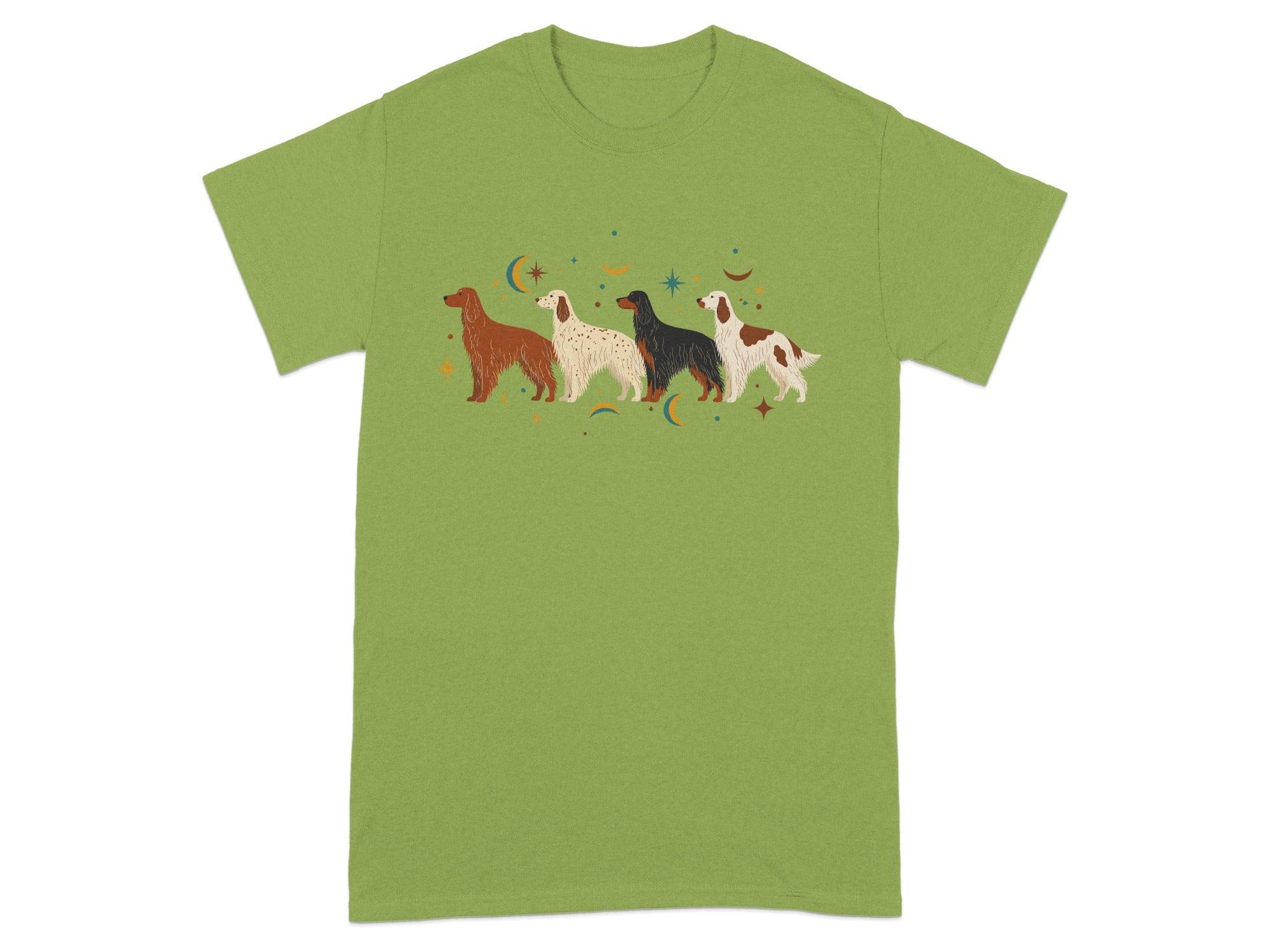 Four dogs in a row with stars and moons on a green t-shirt.