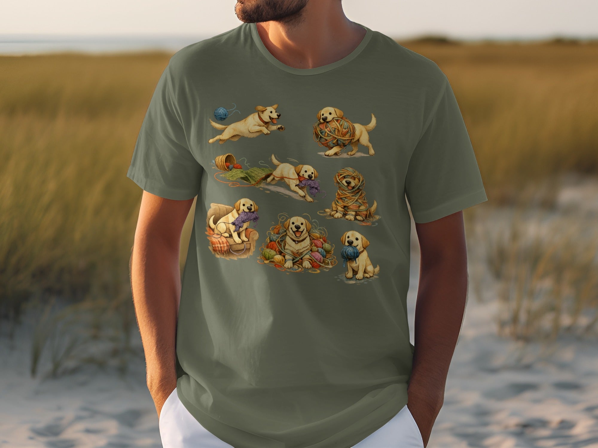 T-shirt with a collage of seven playful golden retriever puppies with yarn.