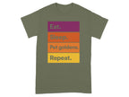 Olive green t-shirt with "Eat. Sleep. Pet goldens. Repeat." text in colored blocks.