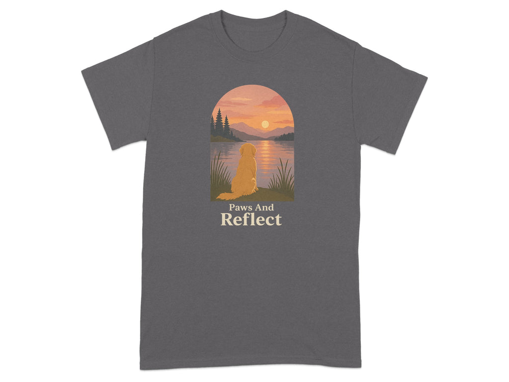 Gray t-shirt with golden retriever sitting by lake at sunset and text "Paws And Reflect".