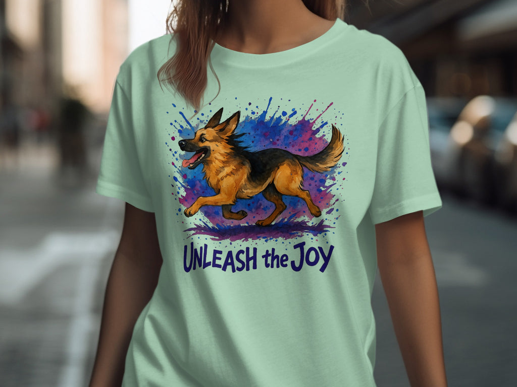 Light green t-shirt with a running German Shepherd and the text "UNLEASH the Joy".