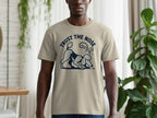 Tan t-shirt with a poodle graphic and the text "TRUST THE NOSE".