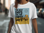 White t-shirt with a golden retriever, sun, and text "The best days are the dirty days".