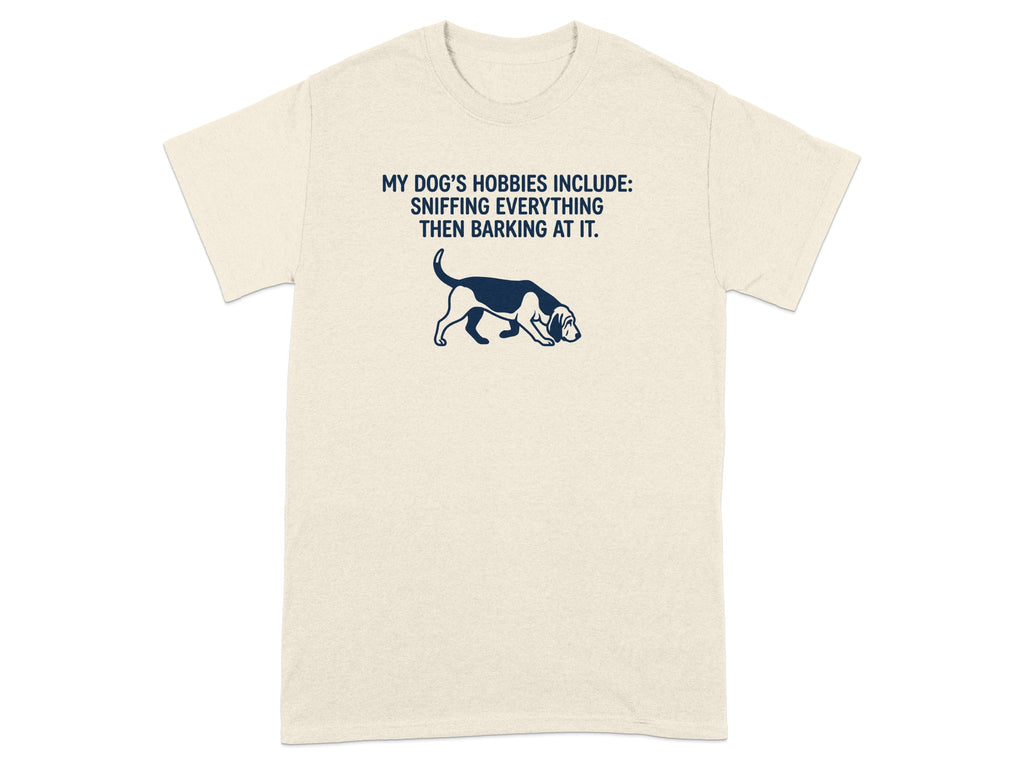 Cream t-shirt with dog illustration and "My Dog's Hobbies" text.