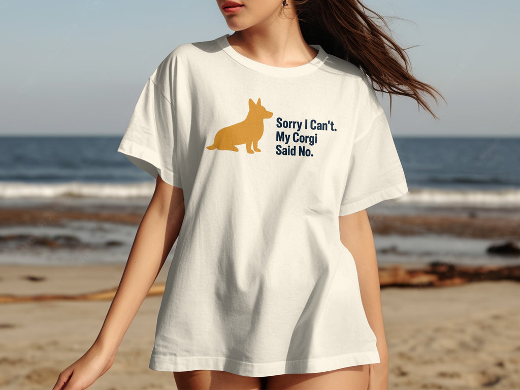 White t-shirt with a corgi silhouette and text "Sorry I Can't. My Corgi Said No."