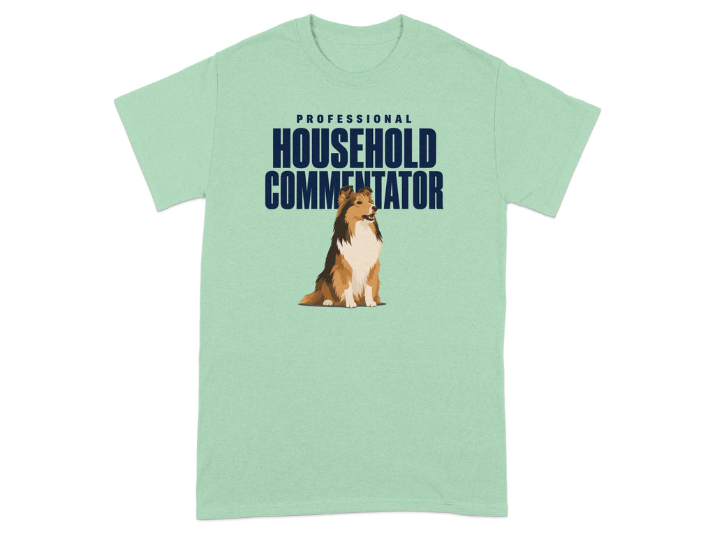 Light green t-shirt with a Sheltie dog and "PROFESSIONAL HOUSEHOLD COMMENTATOR" text.