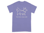 Lightline drawing of dog on lavender t-shirt with text "Slow down, enjoy walks."