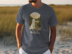 Dark grey t-shirt with a white poodle and "Paws And Reflect" text.