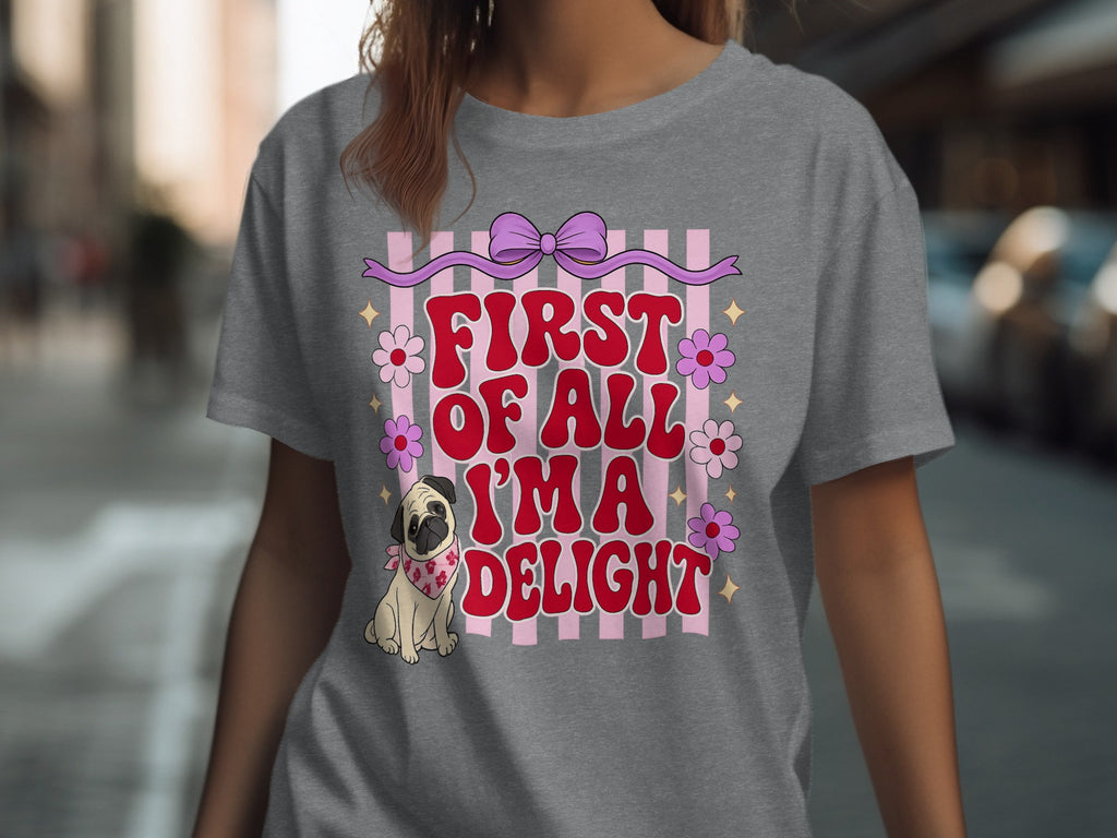 Gray t-shirt with pink text "First of all I'm a delight" and pug graphic.