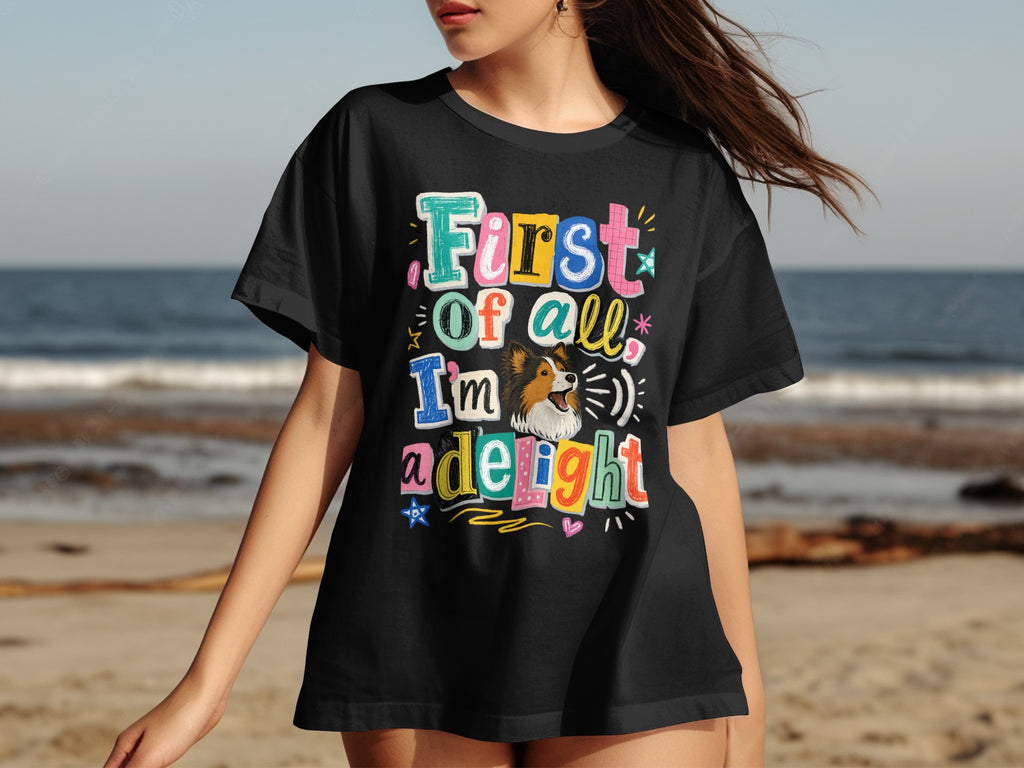 Black t-shirt with text "First of all, I'm a delight" and a dog.
