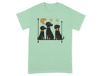 Three black dogs sit on a shelf with decorative elements and a bone.