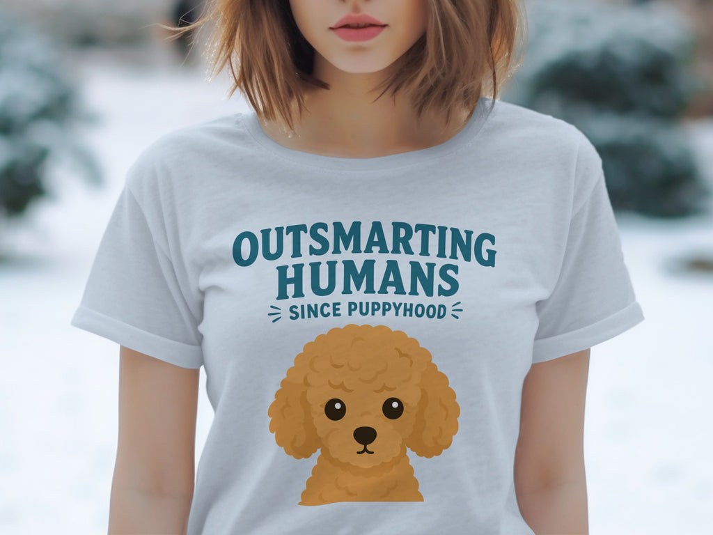 Light blue t-shirt with "Outsmarting Humans Since Puppyhood" and poodle graphic.