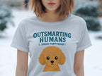 Light blue t-shirt with "Outsmarting Humans Since Puppyhood" and poodle graphic.