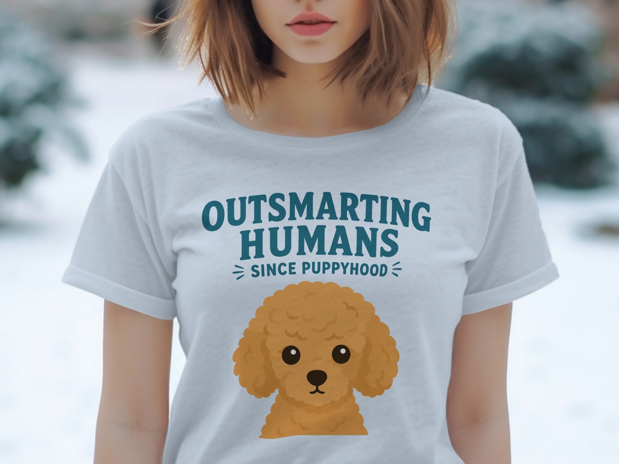 Light blue t-shirt with "Outsmarting Humans Since Puppyhood" and poodle graphic.