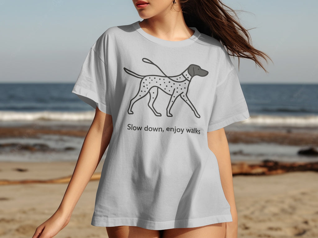 Grey t-shirt with a polka-dotted dog graphic and text "Slow down, enjoy walks".