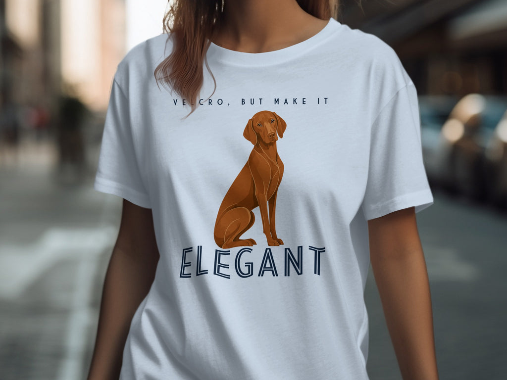 Light blue t-shirt with a Vizsla dog graphic and text "VELCRO, BUT MAKE IT ELEGANT".
