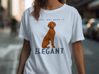 Light blue t-shirt with a Vizsla dog graphic and text "VELCRO, BUT MAKE IT ELEGANT".