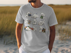 White t-shirt with cartoon poodles reading and sleeping with books.