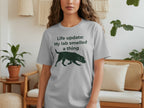 Grey t-shirt with "Life update: My lab smelled a thing" and a silhouette of a dog.