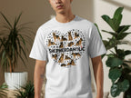 White t-shirt featuring a heart shape made of German Shepherd dogs and paw prints.