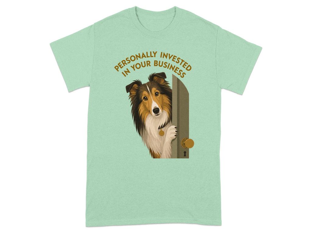 Shetland sheepdog peeking through a doorway on a light green t-shirt.
