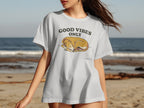 White t-shirt with "GOOD VIBES ONLY" and sleeping dog graphic.