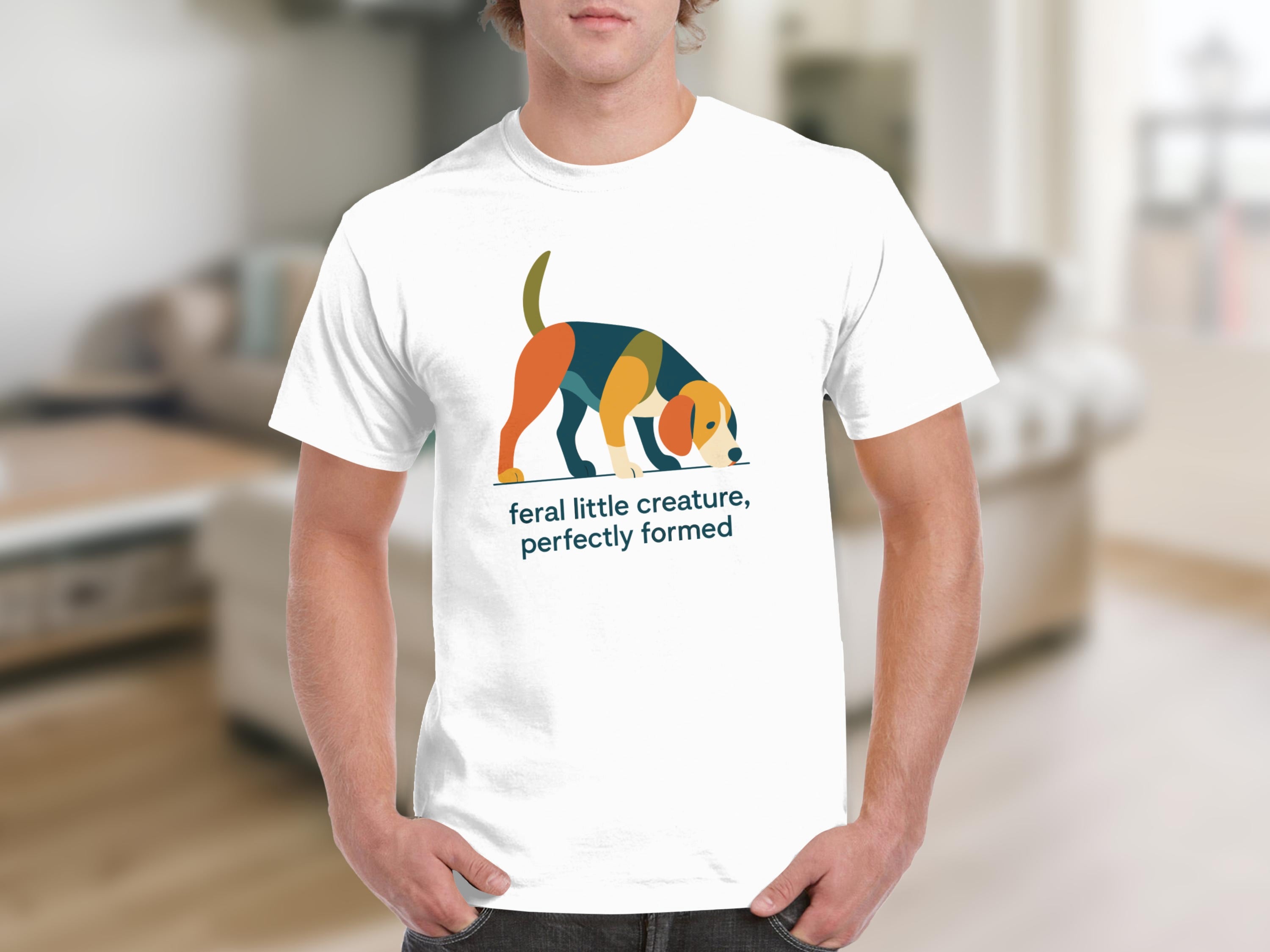 White t-shirt with colorful dog graphic and text "feral little creature, perfectly formed".