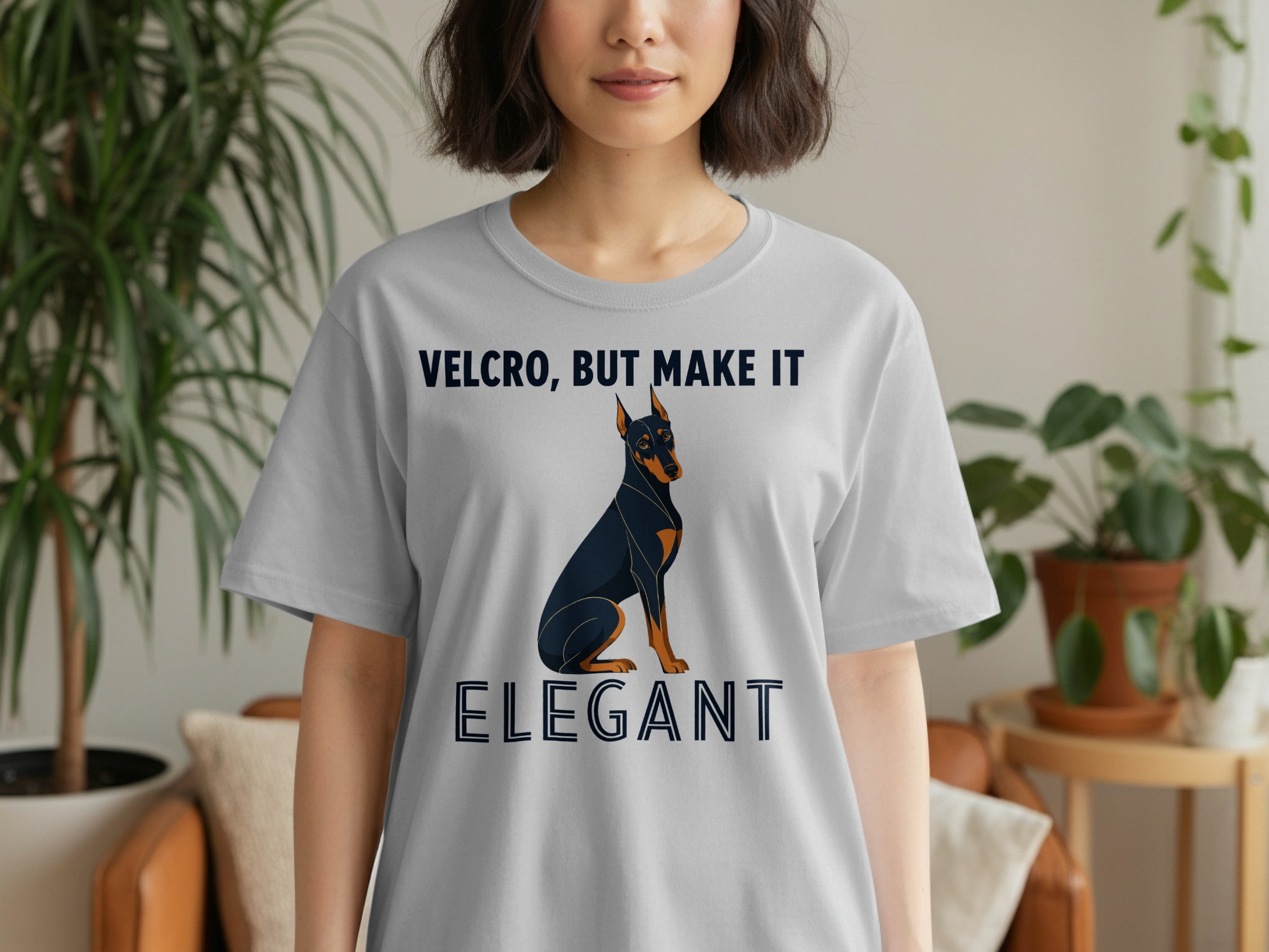 Gray t-shirt with Doberman and "Velcro, but make it elegant" text.