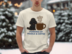 Cream t-shirt with poodle and coffee cup graphic and text "POWERED BY POODLE & COFFEE".