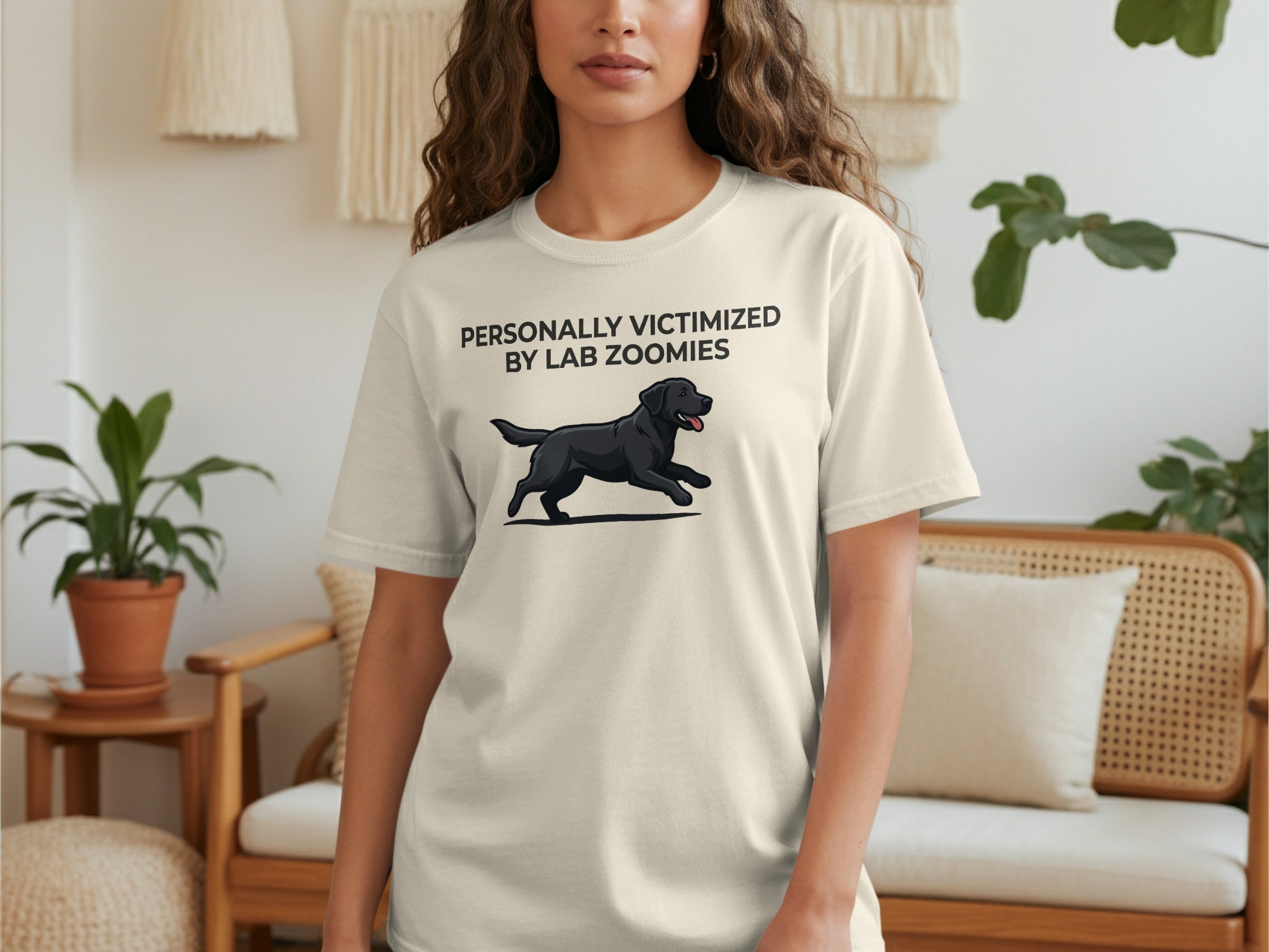 Cream t-shirt with black dog running and text "Personally Victimized by Lab Zoomies".
