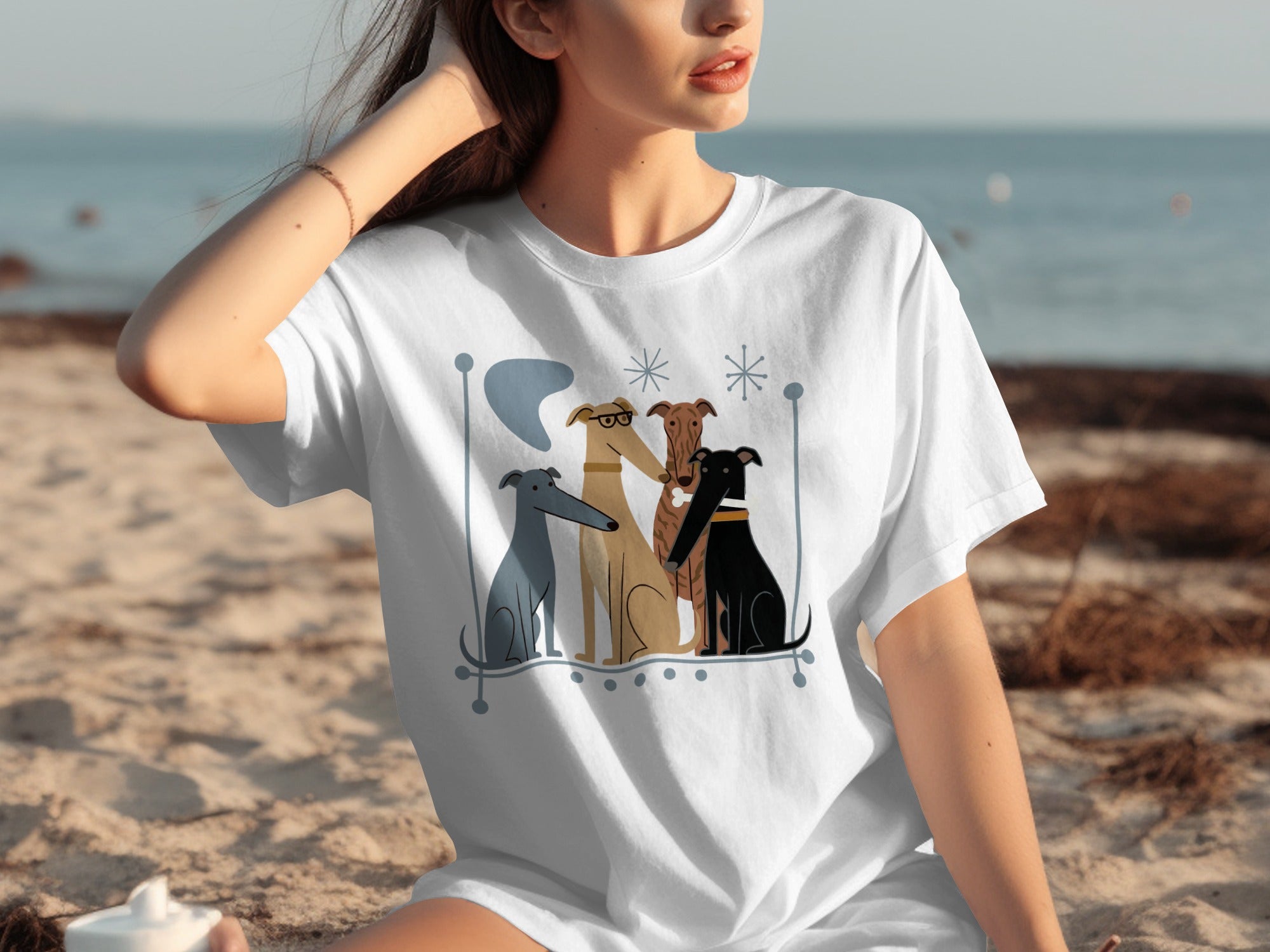 T-shirt featuring abstract drawing of four greyhounds sitting together.