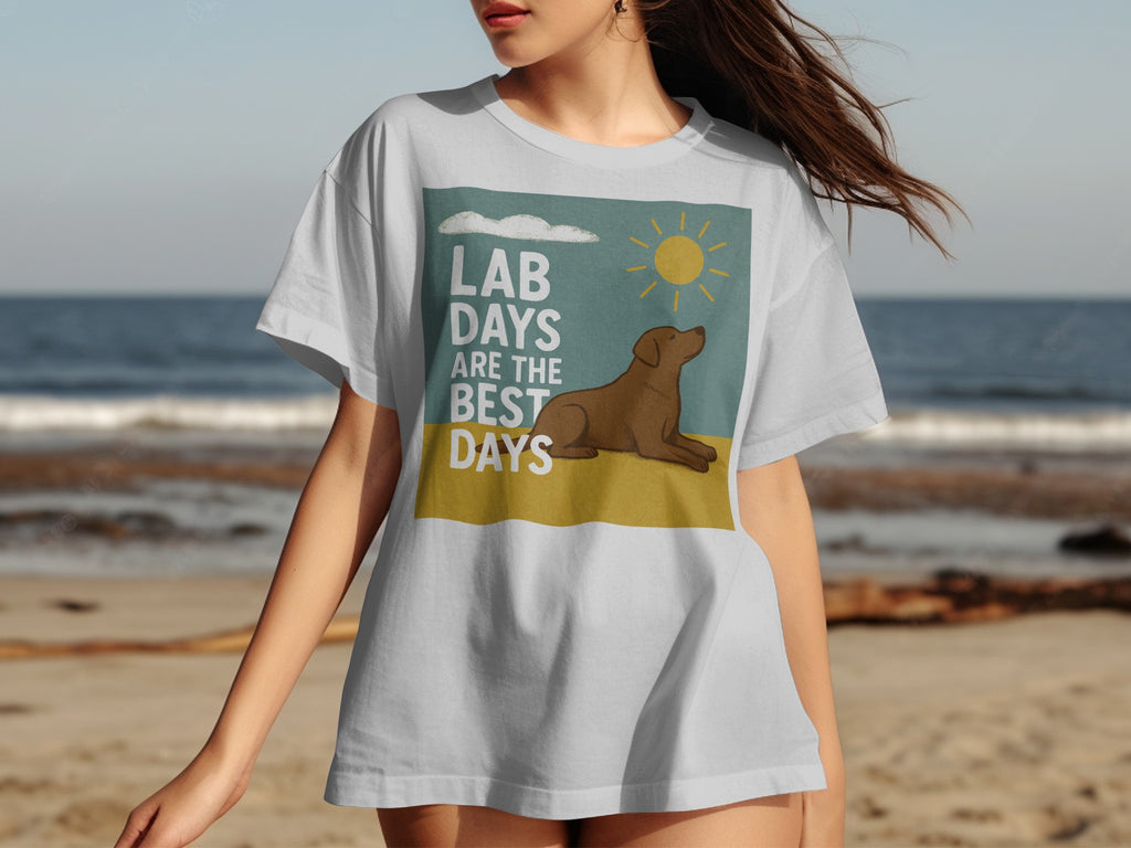 White t-shirt with a graphic of a dog, sun, and clouds saying "Lab days are the best days".