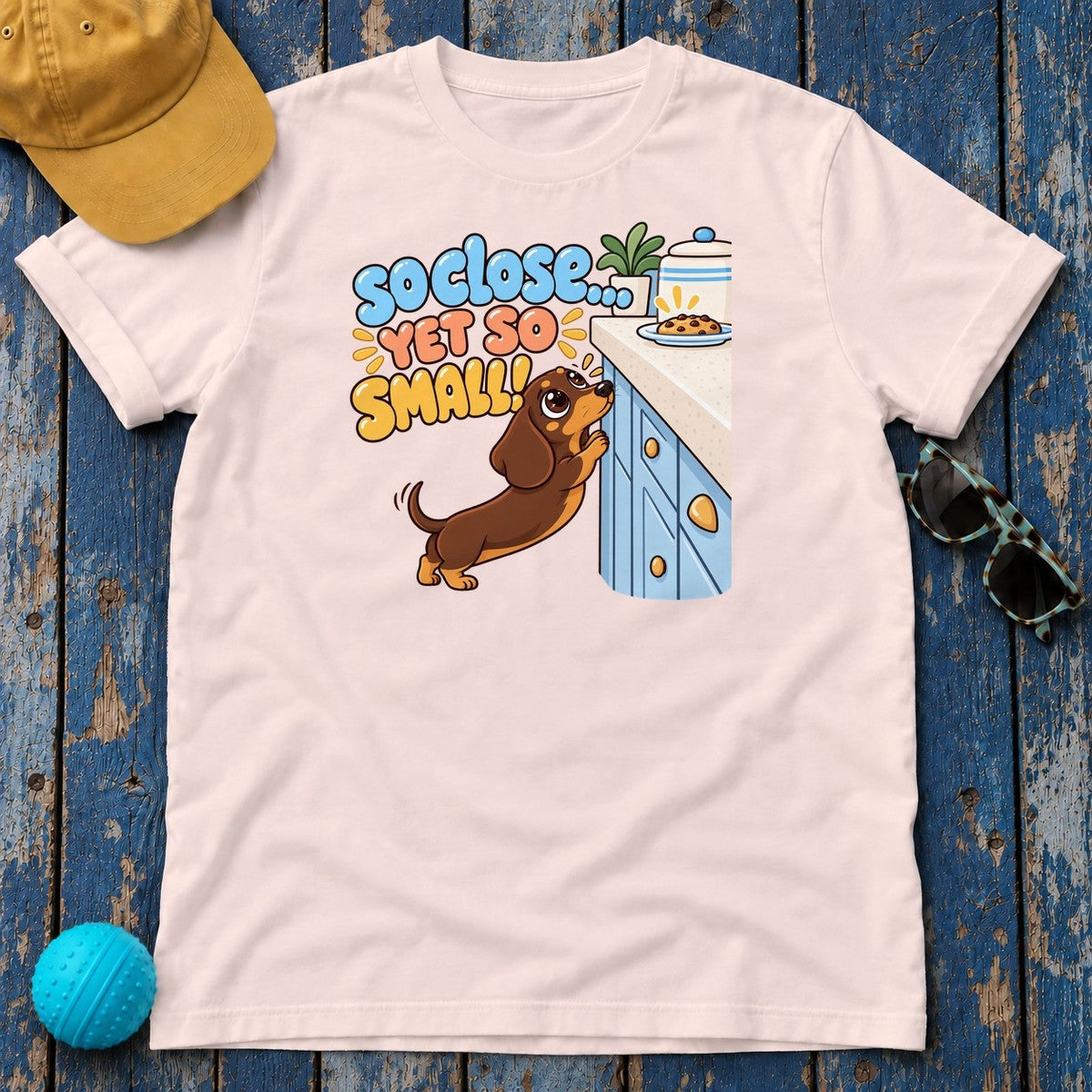 So Close Yet So Small Dachshund T-Shirt in Soft Pink - flat lay