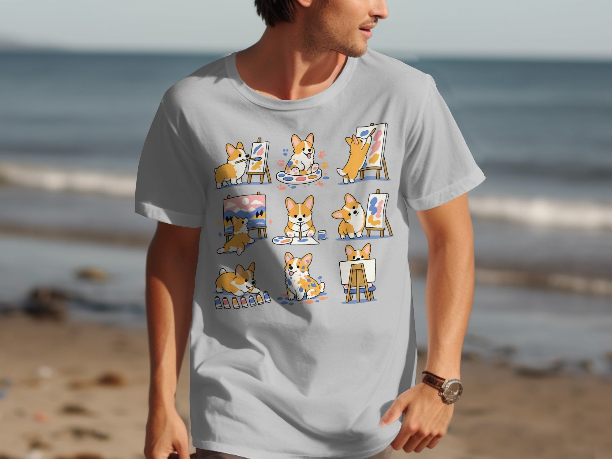 Grey t-shirt featuring montage of adorable corgis painting on easels.