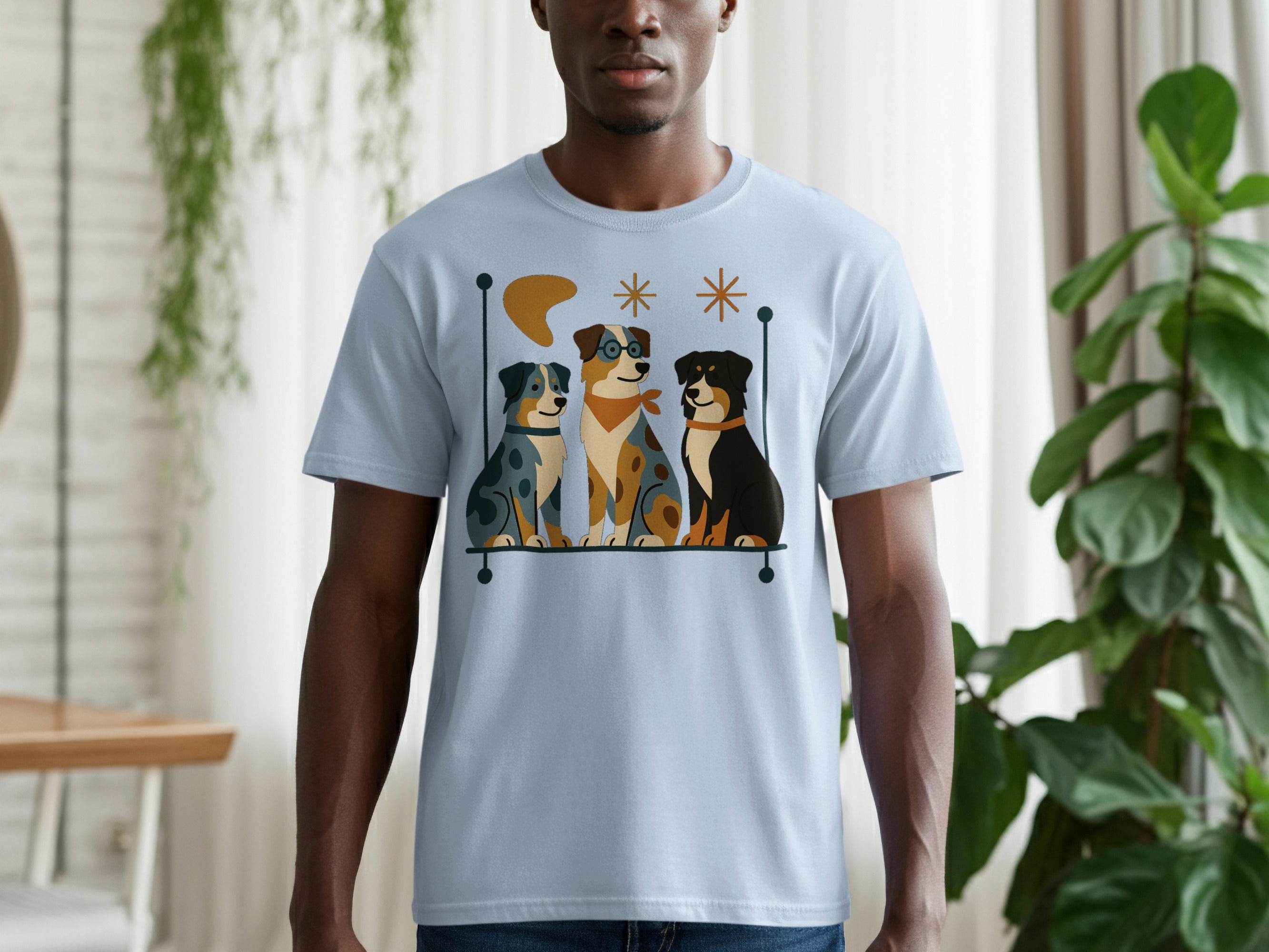 Three cartoon dogs sitting behind a shelf on a light blue t-shirt.