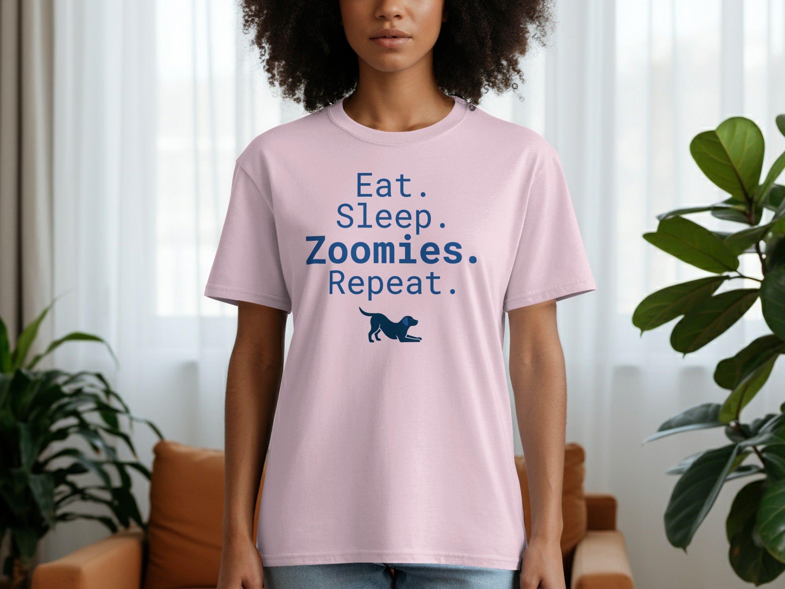 Pink t-shirt with "Eat. Sleep. Zoomies. Repeat." text and a dog silhouette.