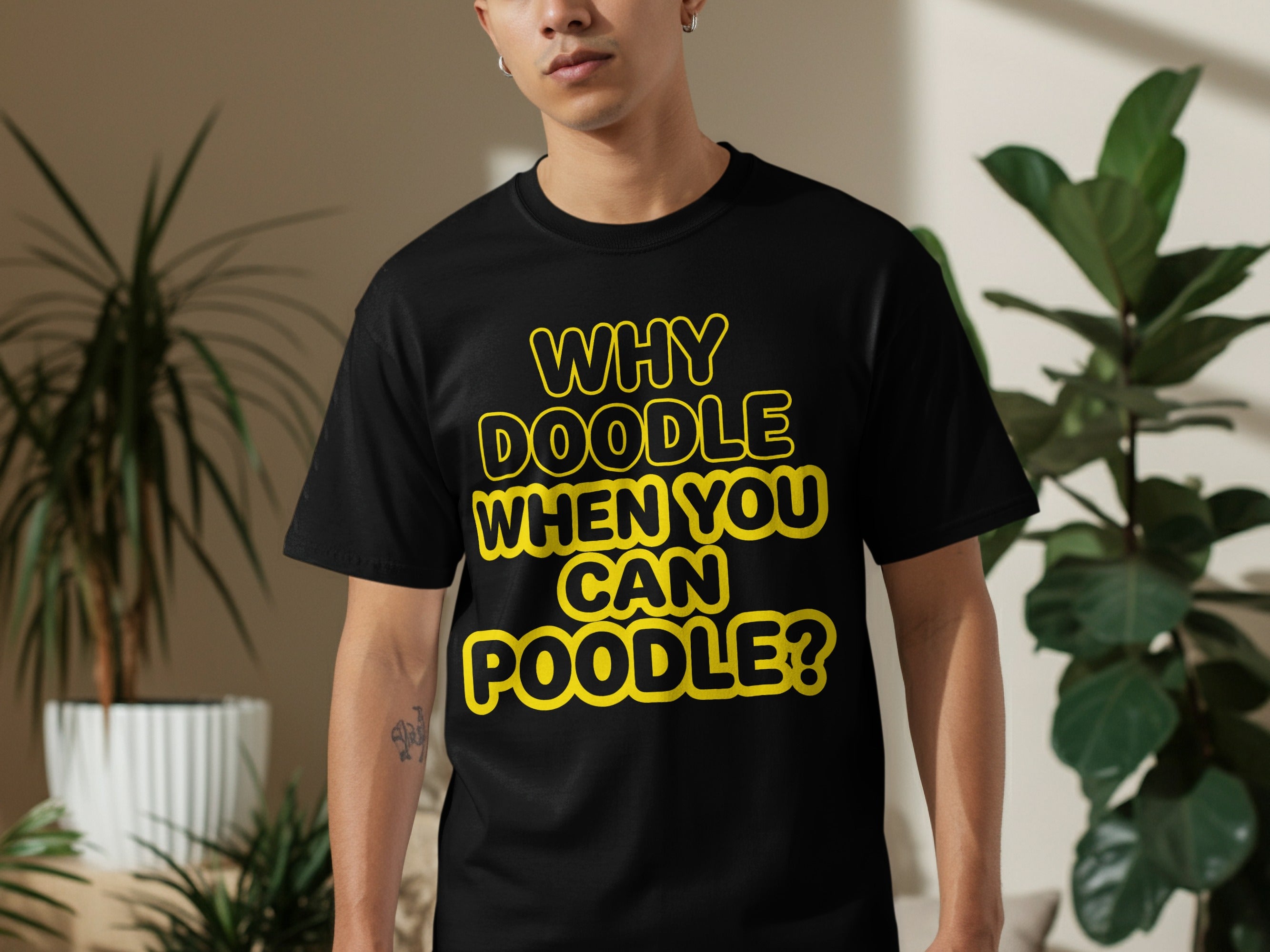 Black t-shirt with yellow text reading "WHY DOODLE WHEN YOU CAN POODLE?"
