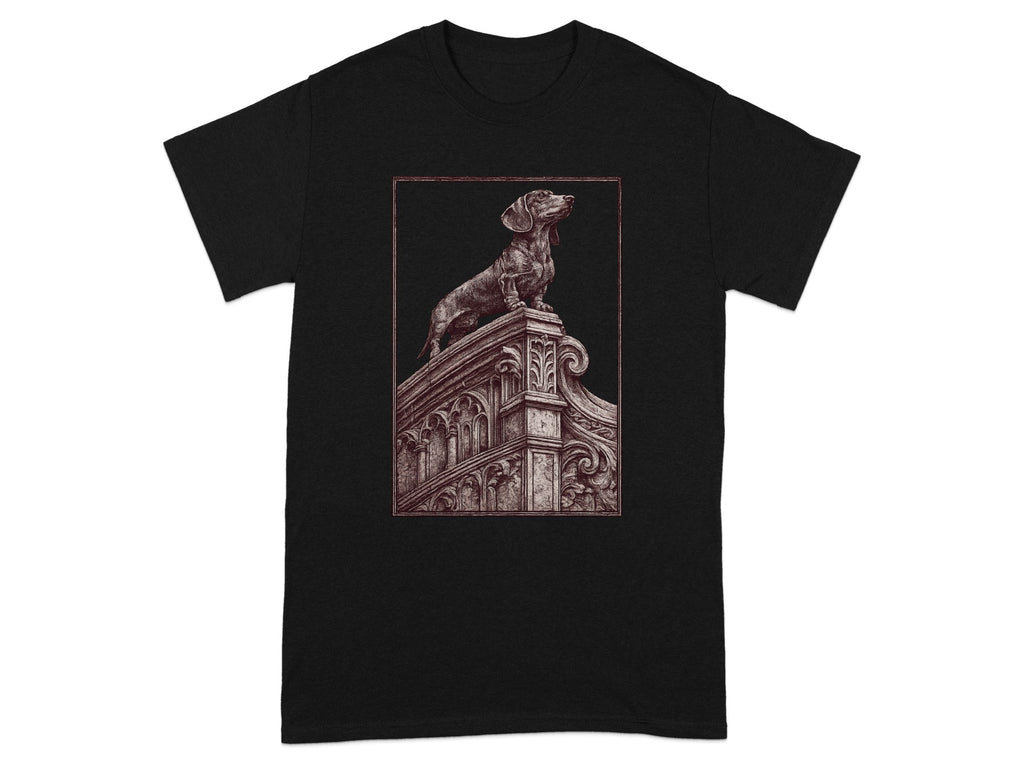 Black t-shirt featuring a detailed etching of a dachshund on ornate architecture.
