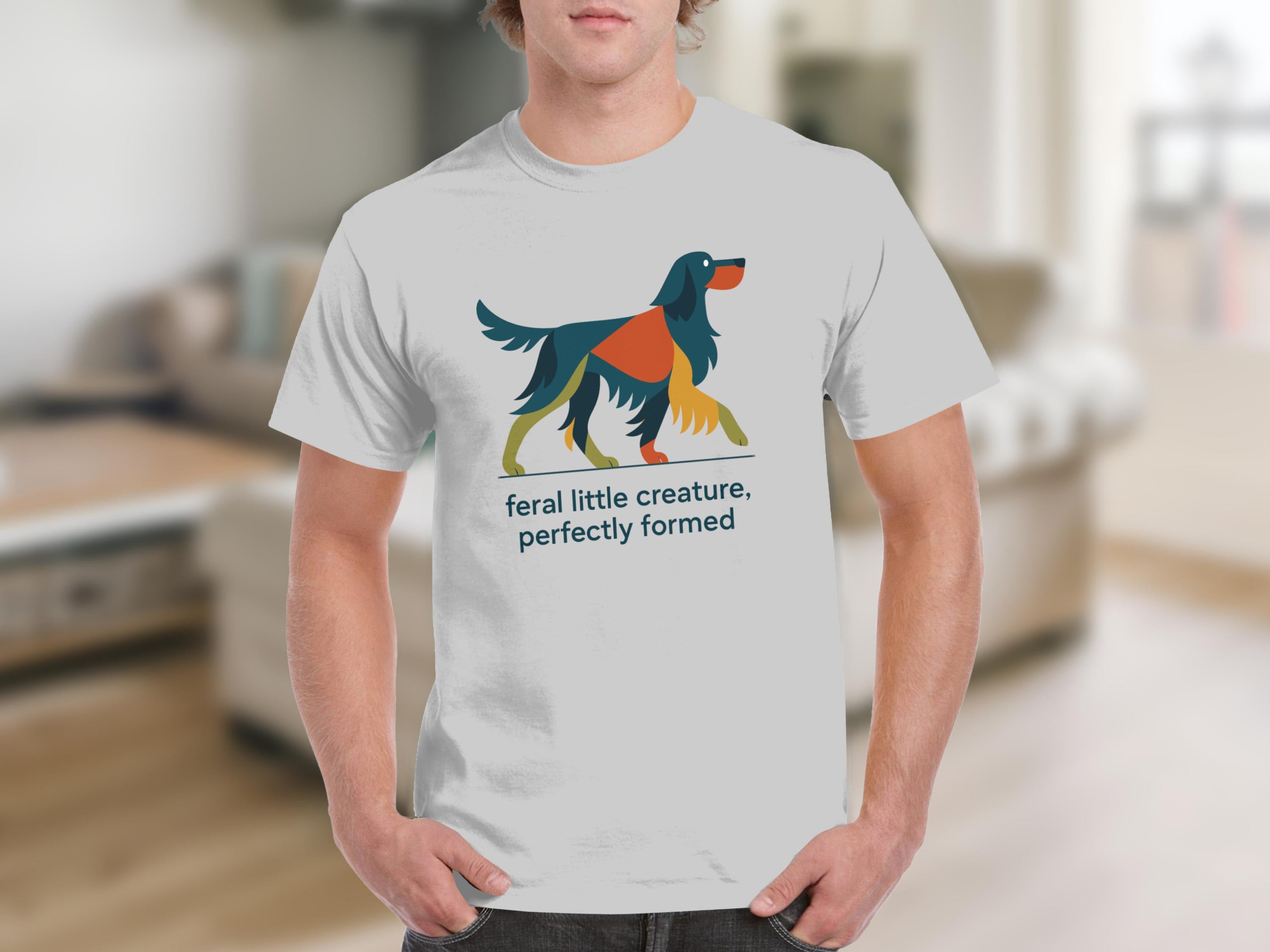 Grey t-shirt with abstract dog graphic and text "feral little creature, perfectly formed".
