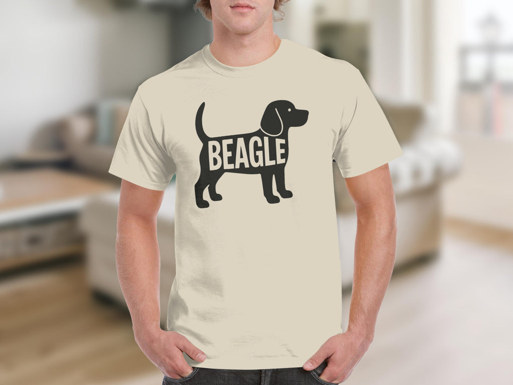 Beagle silhouette with text on a cream t-shirt worn by a person.