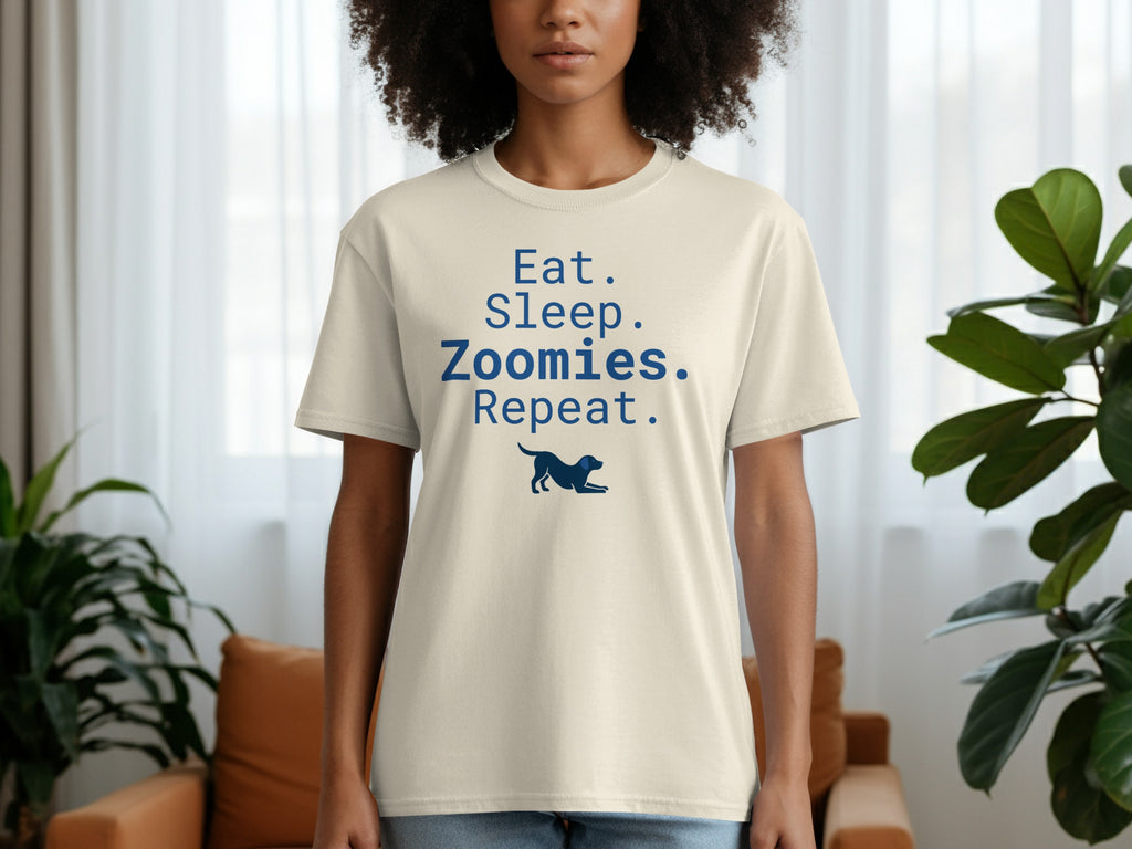 Cream t-shirt with "Eat. Sleep. Zoomies. Repeat." and a dog silhouette.