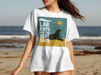 White t-shirt with graphic text "LAB DAYS ARE THE BEST DAYS" and a black lab on the beach.