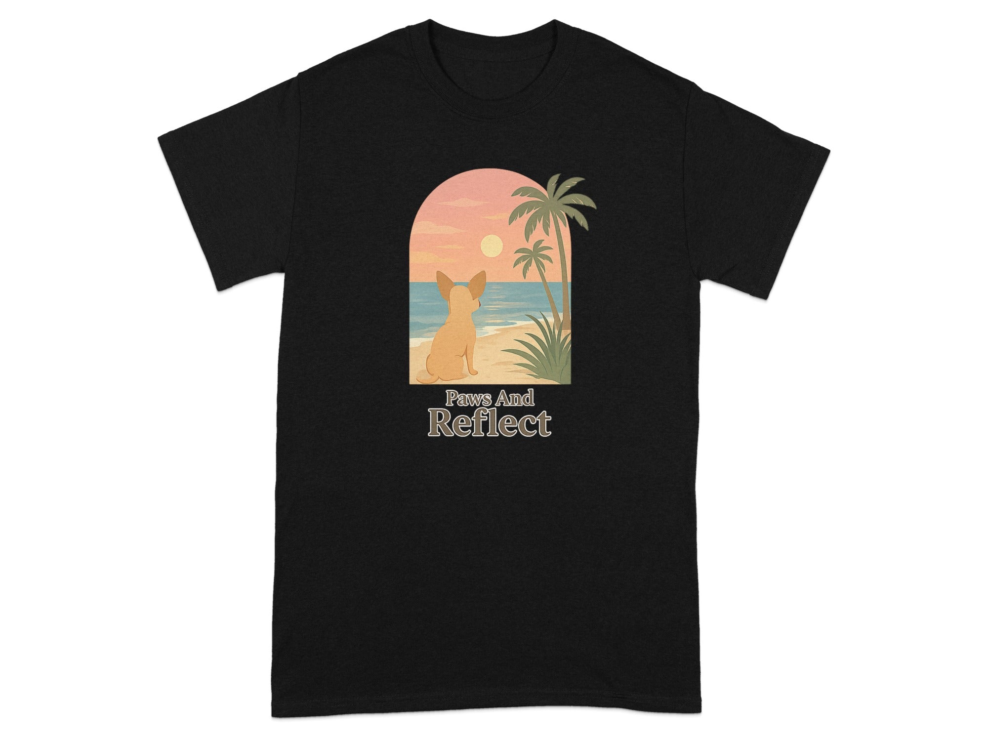 Black t-shirt with illustration of dog sitting on beach at sunset with text "Paws And Reflect."