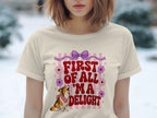 Cream t-shirt with a corgi and "First of all 'm a delight" text design.