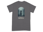 Gray t-shirt with a dog sitting by a lake with text "Paws And Reflect".