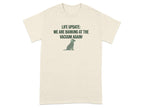 Cream t-shirt with "LIFE UPDATE: WE ARE BARKING AT THE VACUUM AGAIN!" and a dog graphic.