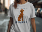 White t-shirt with a Vizsla dog and "VELCRO, BUT MAKE IT ELEGANT" text.