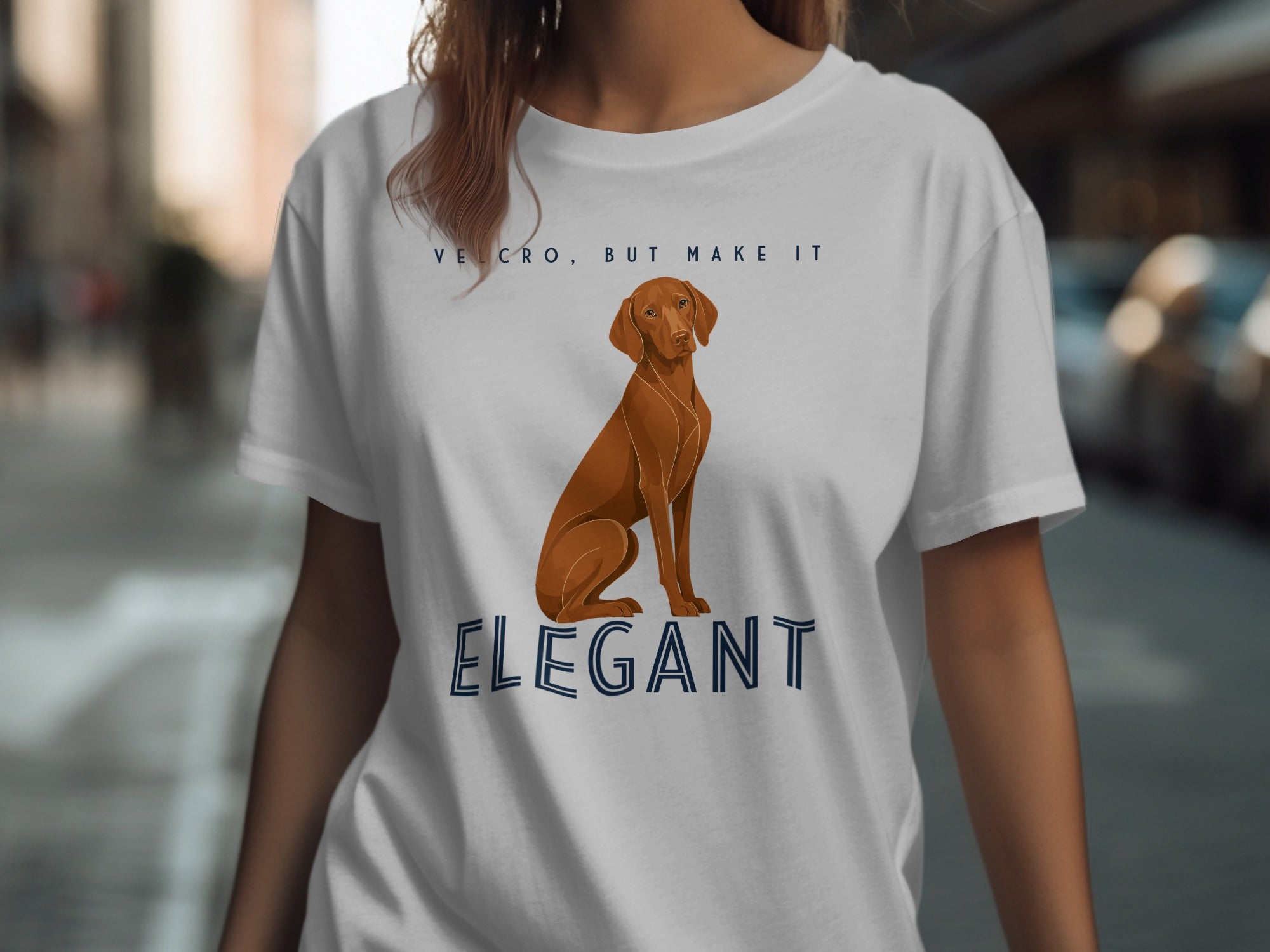White t-shirt with a Vizsla dog and "VELCRO, BUT MAKE IT ELEGANT" text.