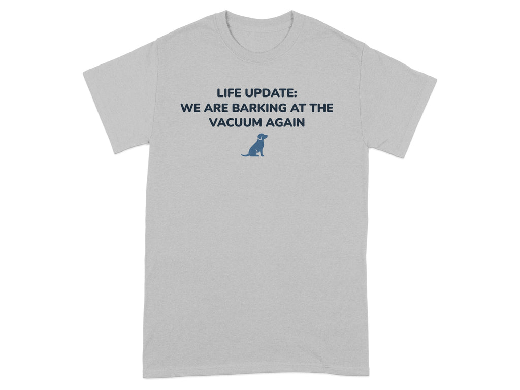 Light gray t-shirt with blue text "LIFE UPDATE: WE ARE BARKING AT THE VACUUM AGAIN" and a dog icon.